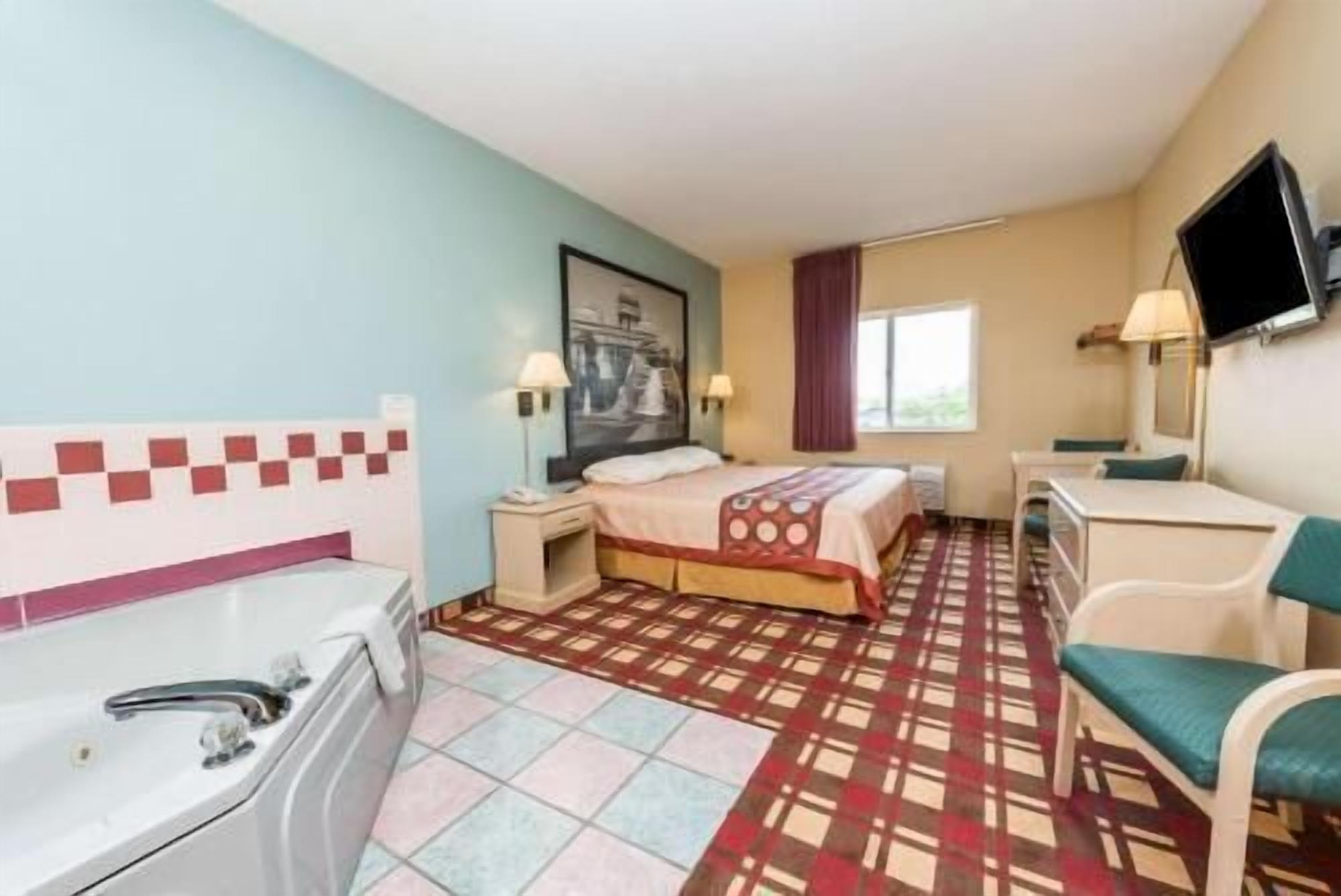 Desk, laptop workspace, blackout drapes, cribs/infant beds