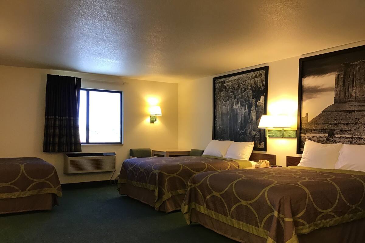 Desk, laptop workspace, iron/ironing board, free cribs/infant beds