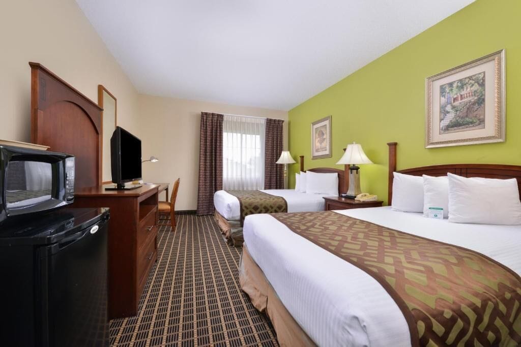 Standard Room, 2 Queen Beds, Non Smoking | Minibar, desk, laptop workspace, blackout drapes