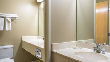 Suite, 1 King Bed | Bathroom | Combined shower/bathtub, hair dryer, towels
