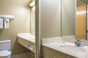 Suite, 1 King Bed | Bathroom | Combined shower/tub, hair dryer, towels