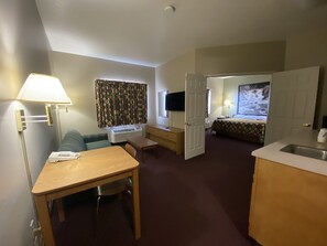 Suite, 1 King Bed | Living area | Flat-screen TV