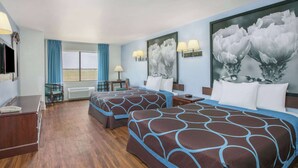 A hotel room with two beds, a desk, a chair, and a window with curtains. - Super 8 by Wyndham Garland North Dallas Area (Garland)