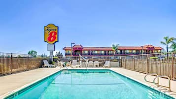 Seasonal outdoor pool, open 9:00 AM to 9:00 PM, pool umbrellas