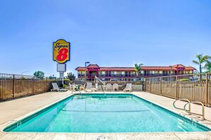 Seasonal outdoor pool, open 9:00 AM to 9:00 PM, pool umbrellas