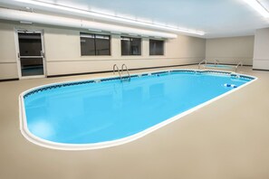 Indoor pool, open 10:00 AM to 10:00 PM, pool loungers