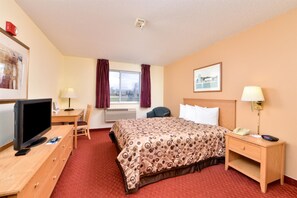 Relax in this inviting space with a large bed, flat-screen TV, and comfortable workspace.