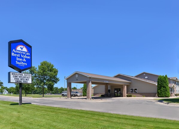 Americas Best Value Inn & Suites offers a welcoming entrance with a covered area and beautifully maintained grounds.