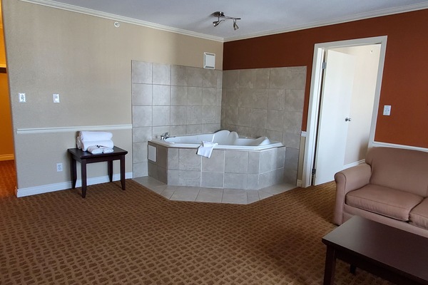 Suite, 1 King Bed | Living room | TV
