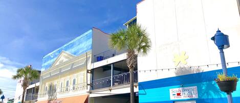 A hotel with a sign for 'Sea & Breeze Hotel & Tybee Island'.