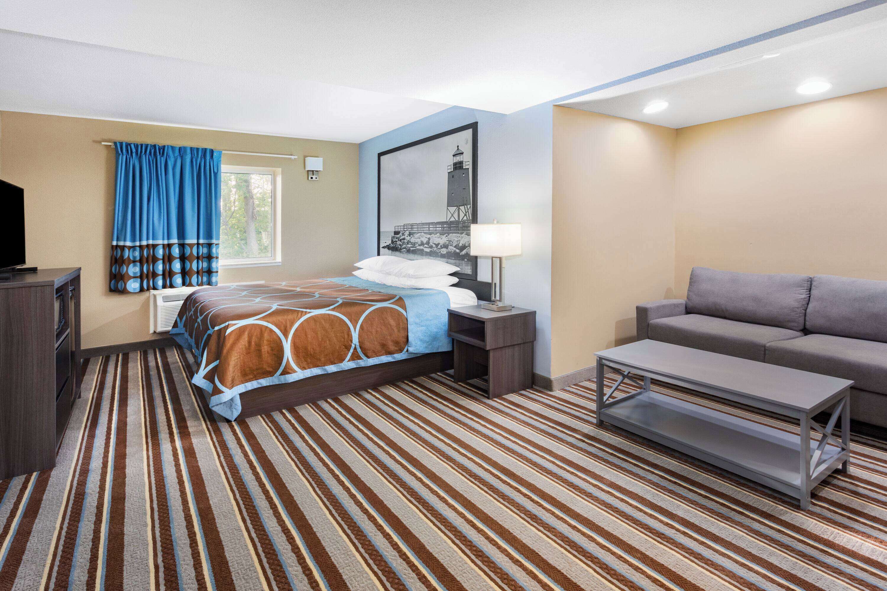 Studio Suite, 1 King Bed, Non Smoking (Exterior Entrance) | Desk, laptop workspace, blackout drapes, iron/ironing board