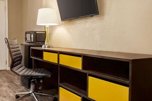 Desk, blackout drapes, iron/ironing board, free cribs/infant beds