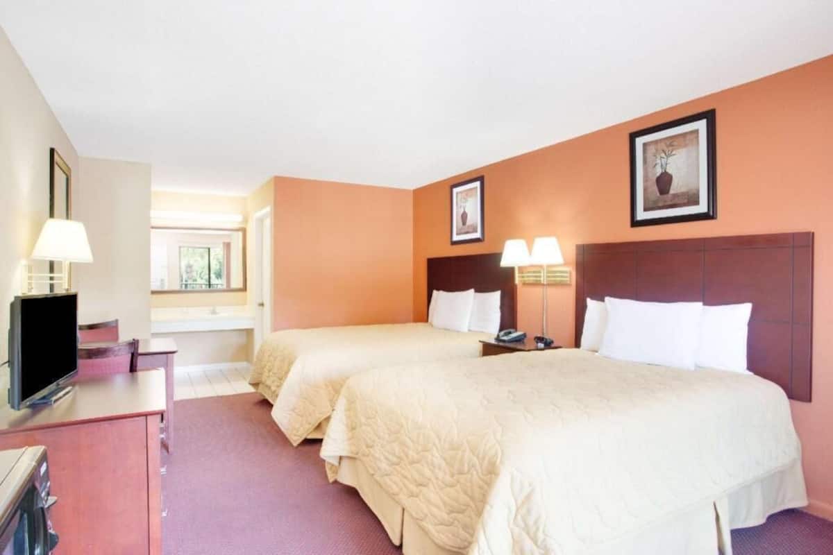 Blackout drapes, iron/ironing board, free cribs/infant beds