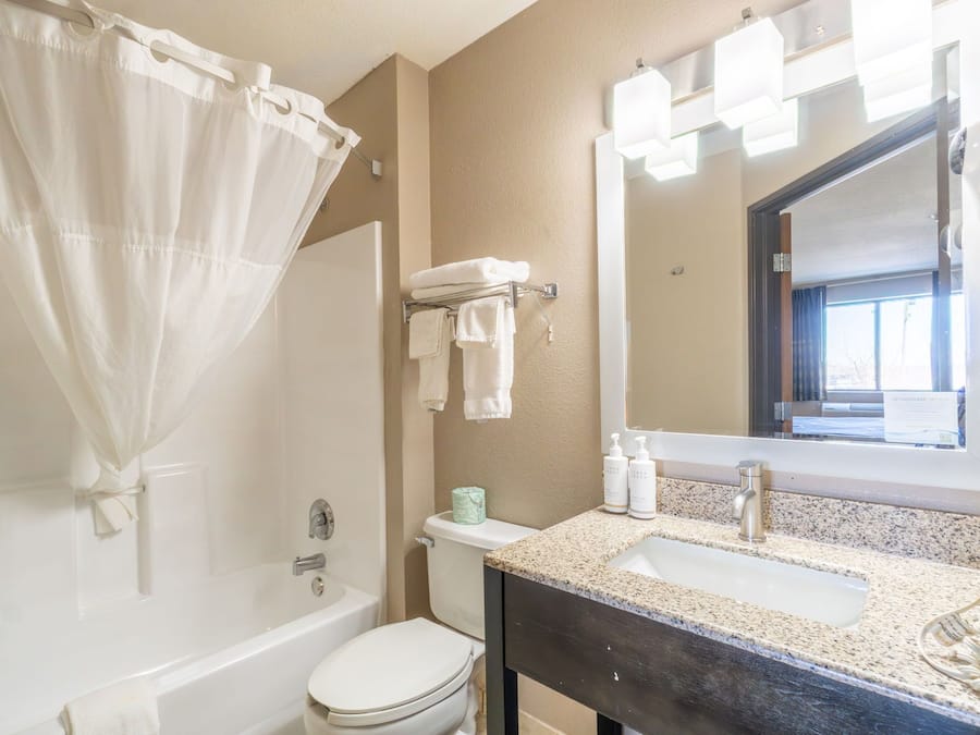 Combined shower/tub, deep soaking tub, rainfall showerhead, hair dryer