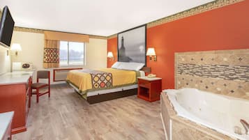Deluxe Suite, 1 King Bed, Non Smoking | Desk, laptop workspace, blackout curtains, iron/ironing board