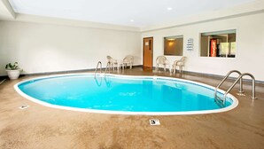 An indoor swimming pool with a 3 FT depth marker, surrounded by white walls and a ceiling with recessed lighting. - Super 8 by Wyndham Bonne Terre (Bonne Terre)