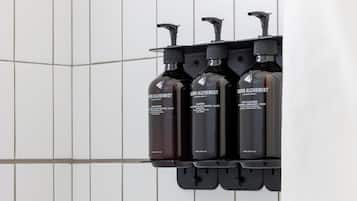 Designer toiletries, hair dryer, towels, soap