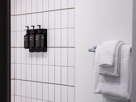 Designer toiletries, hair dryer, towels, soap