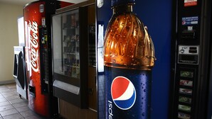 A vending machine area with a Coca-Cola and a Pepsi dispenser. - Super 8 by Wyndham Jamestown (Jamestown)