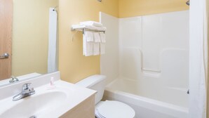 A bathroom with a sink, toilet, and bathtub. - Super 8 by Wyndham Medina (Medina)