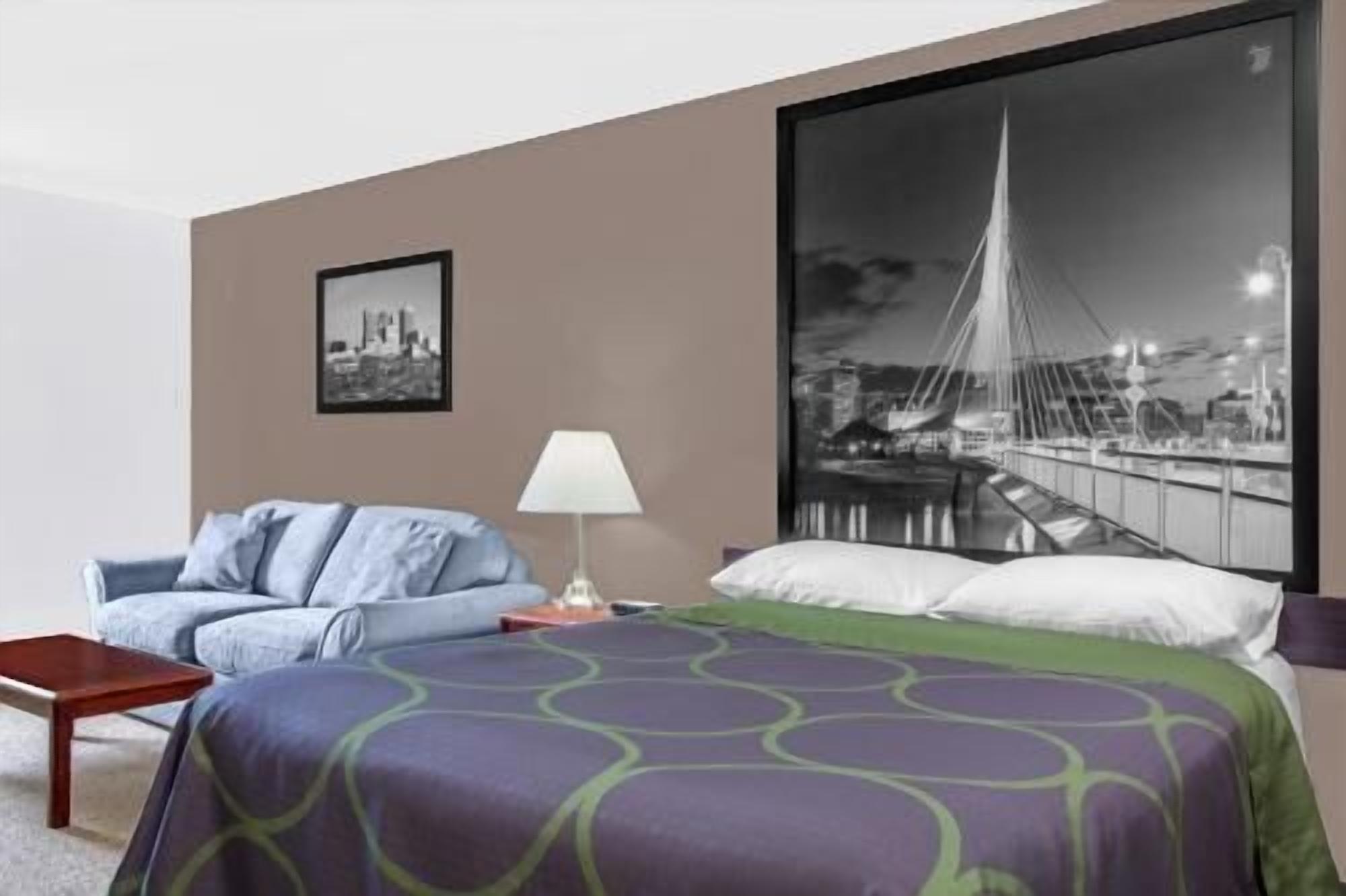 Desk, blackout drapes, iron/ironing board, rollaway beds
