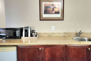Desk, blackout drapes, iron/ironing board, rollaway beds