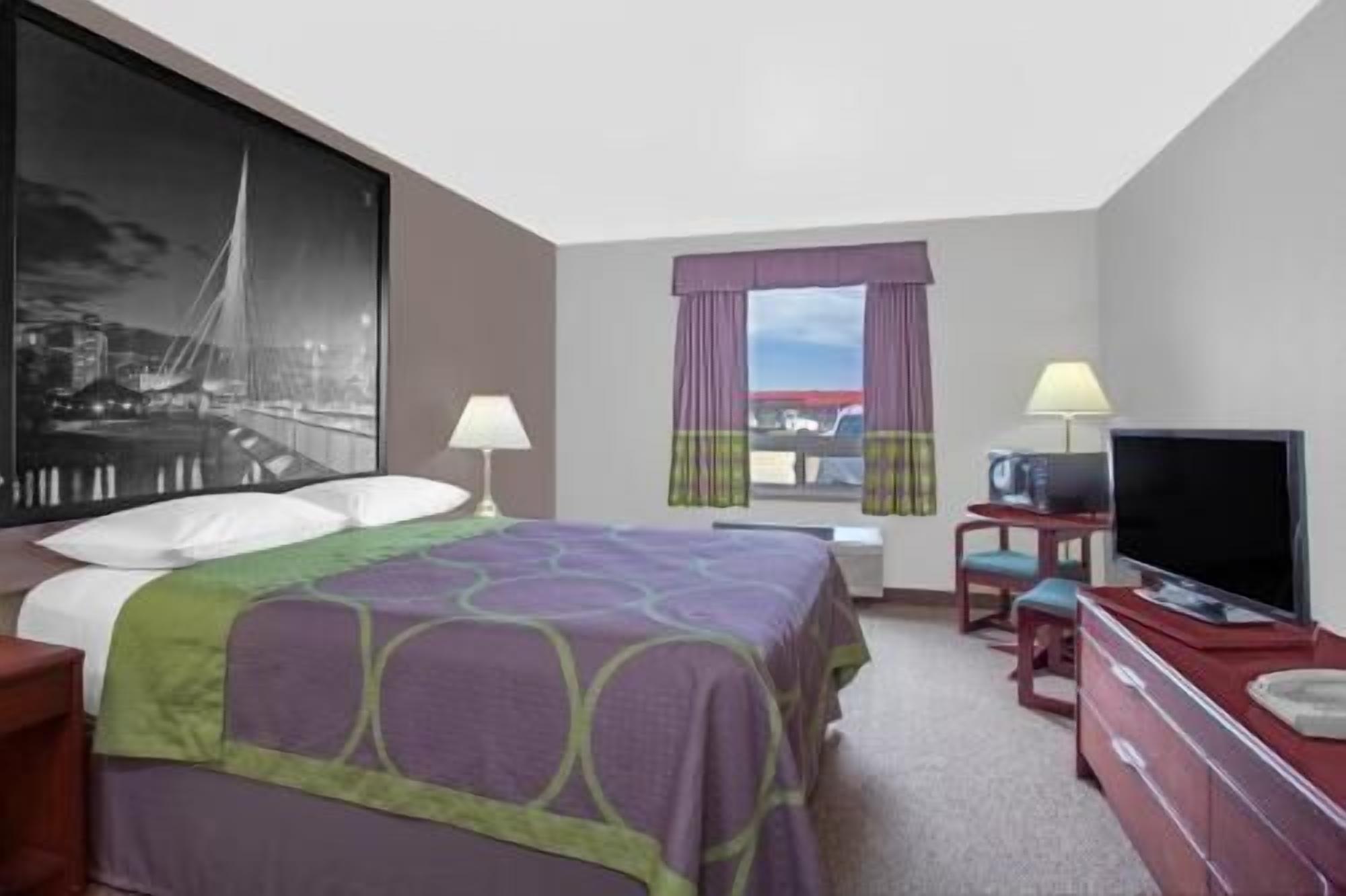 Desk, blackout drapes, iron/ironing board, rollaway beds