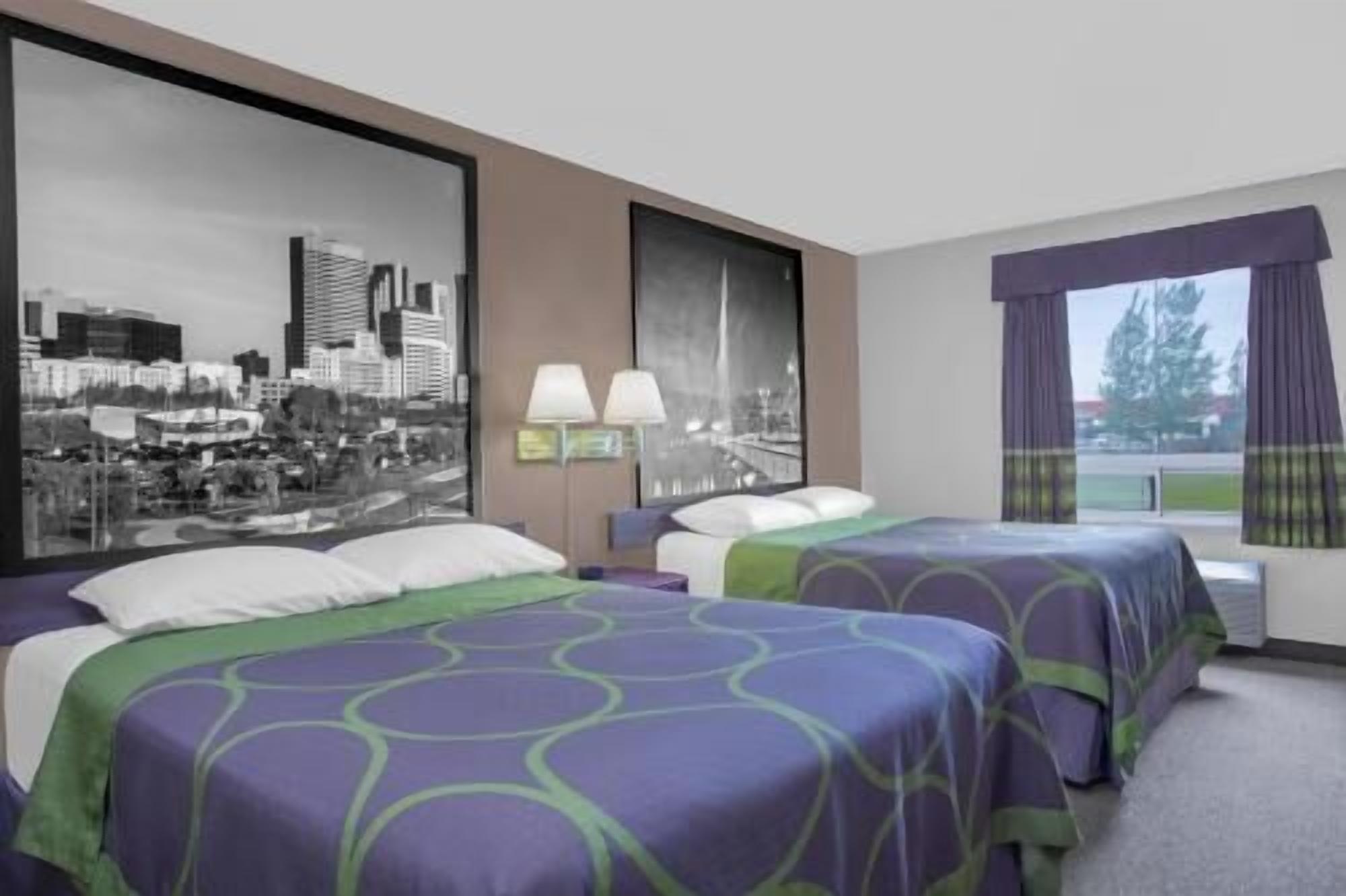 Desk, blackout drapes, iron/ironing board, rollaway beds