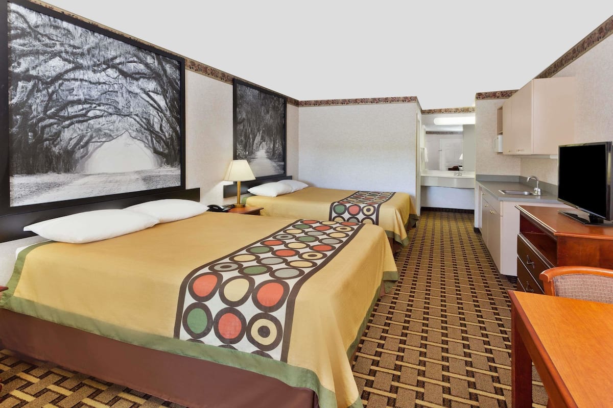 Premium bedding, desk, laptop workspace, blackout drapes