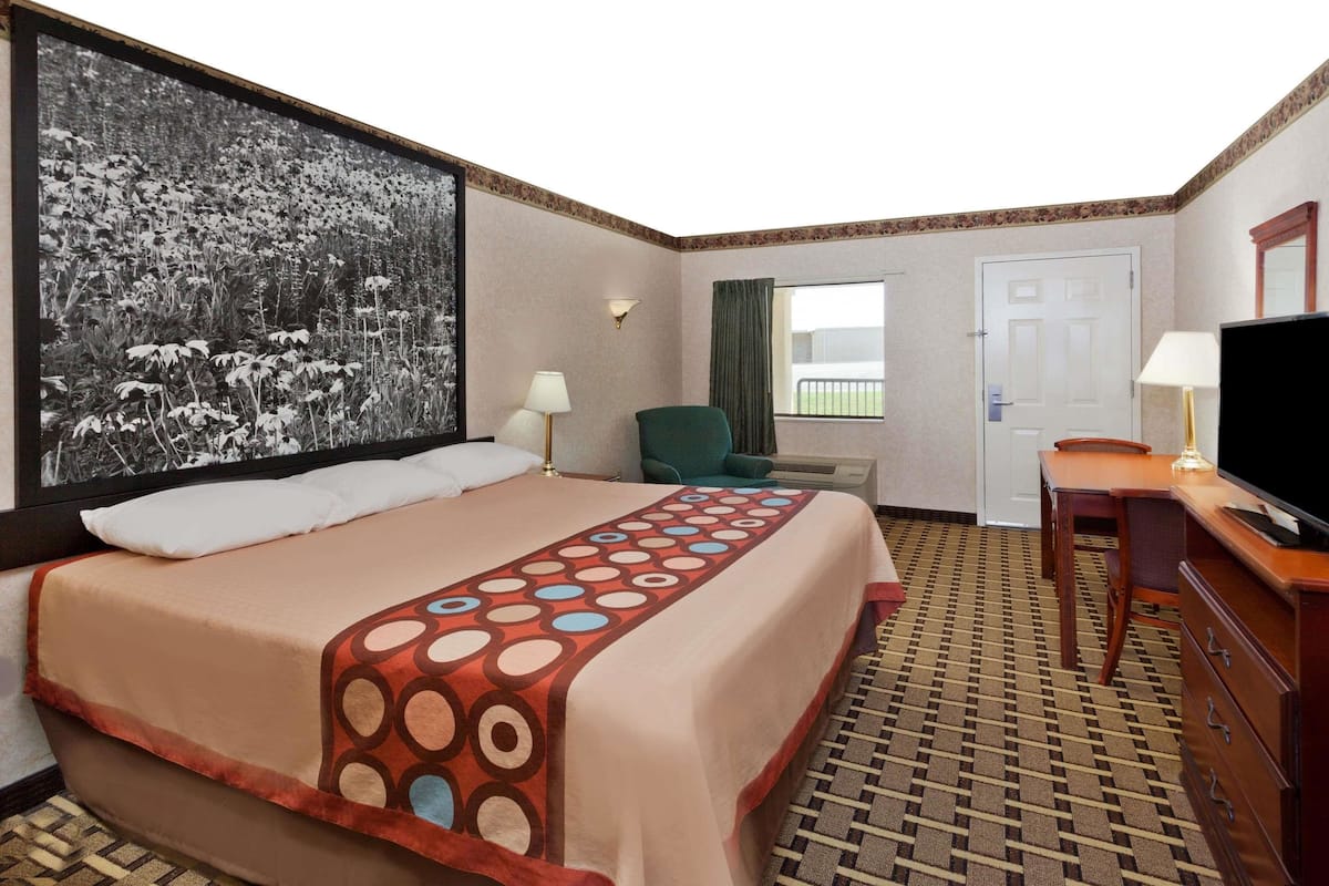 Premium bedding, desk, laptop workspace, blackout drapes