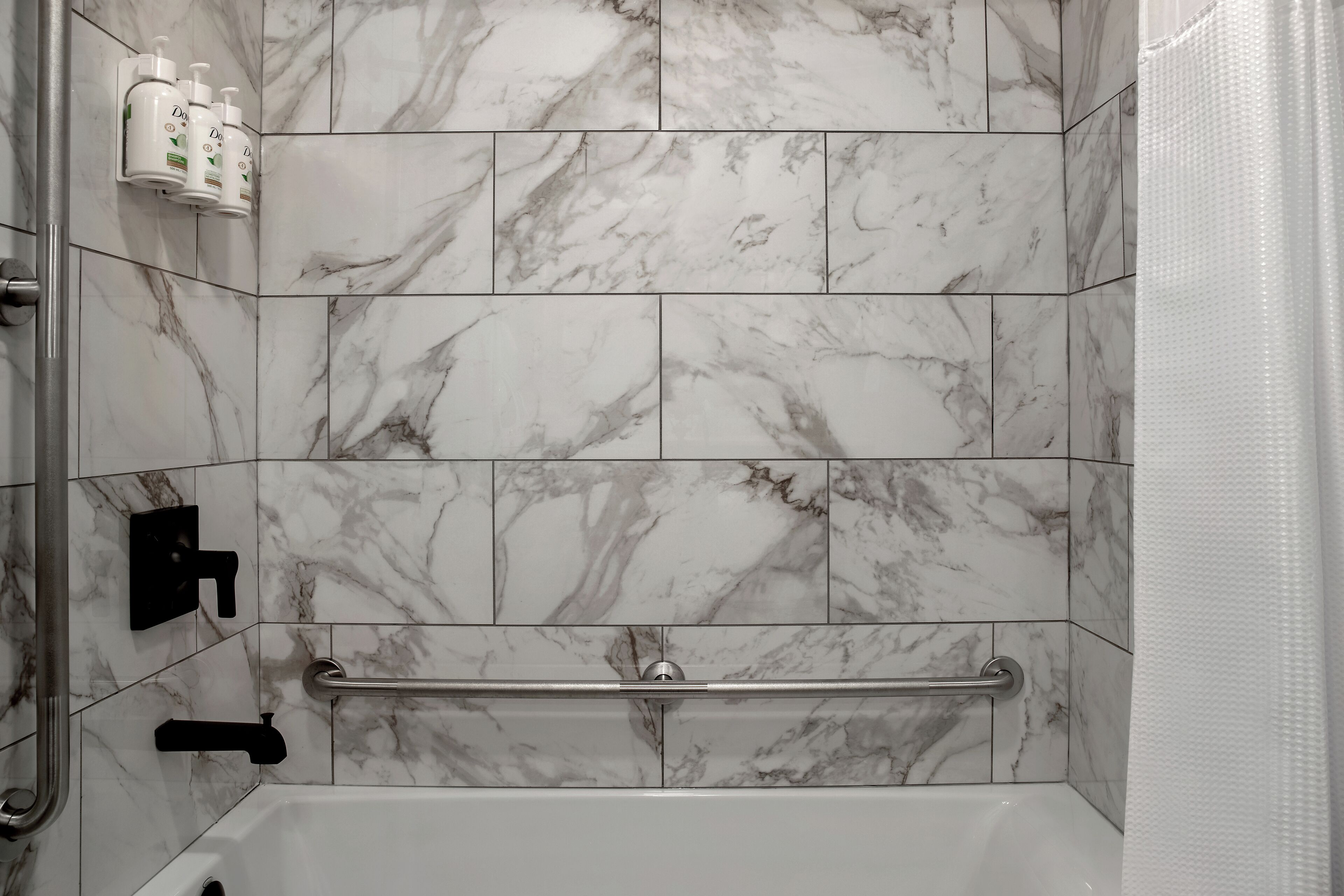 designer toiletries, hair dryer, towels, soap