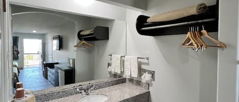 Basic Room, 1 King Bed, Non Smoking | Bathroom | Combined shower/bathtub, free toiletries, hair dryer, towels