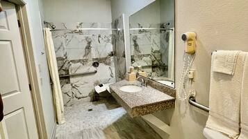 Basic Room, 1 King Bed, Non Smoking | Bathroom | Combined shower/tub, free toiletries, hair dryer, towels