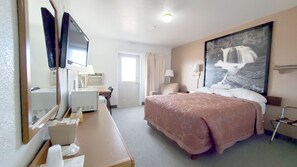 Desk, laptop workspace, blackout drapes, iron/ironing board