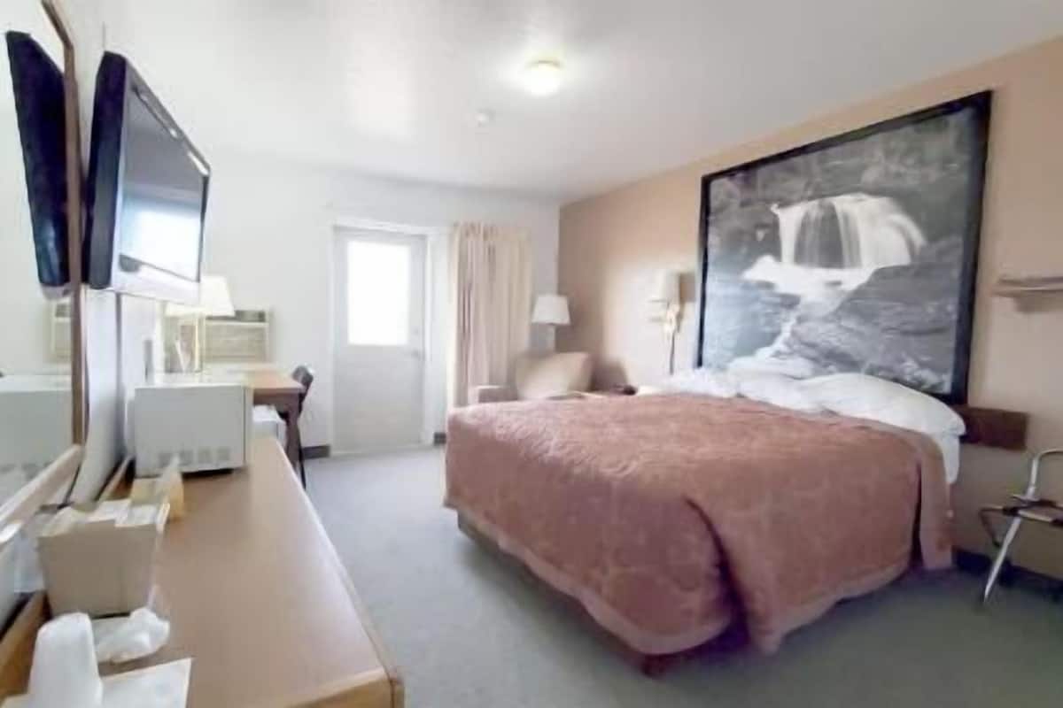Desk, laptop workspace, blackout curtains, iron/ironing board
