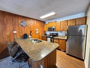 Unit 114 | Private kitchen | Full-size fridge, microwave, oven, stovetop
