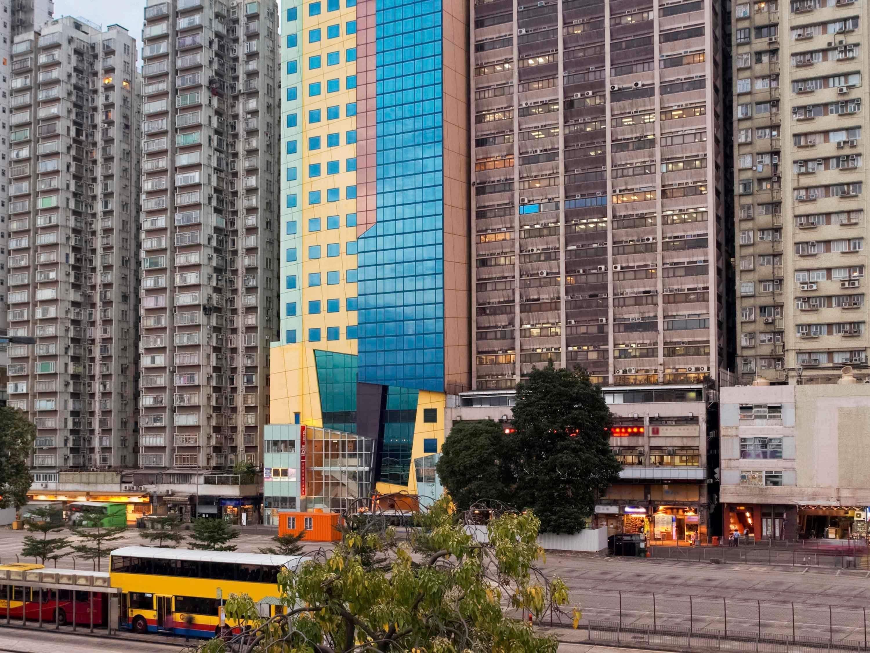 A high-rise building with a distinctive facade, surrounded by other tall residential buildings.