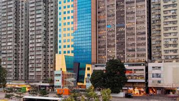 A high-rise building with a distinctive facade, surrounded by other tall residential buildings.