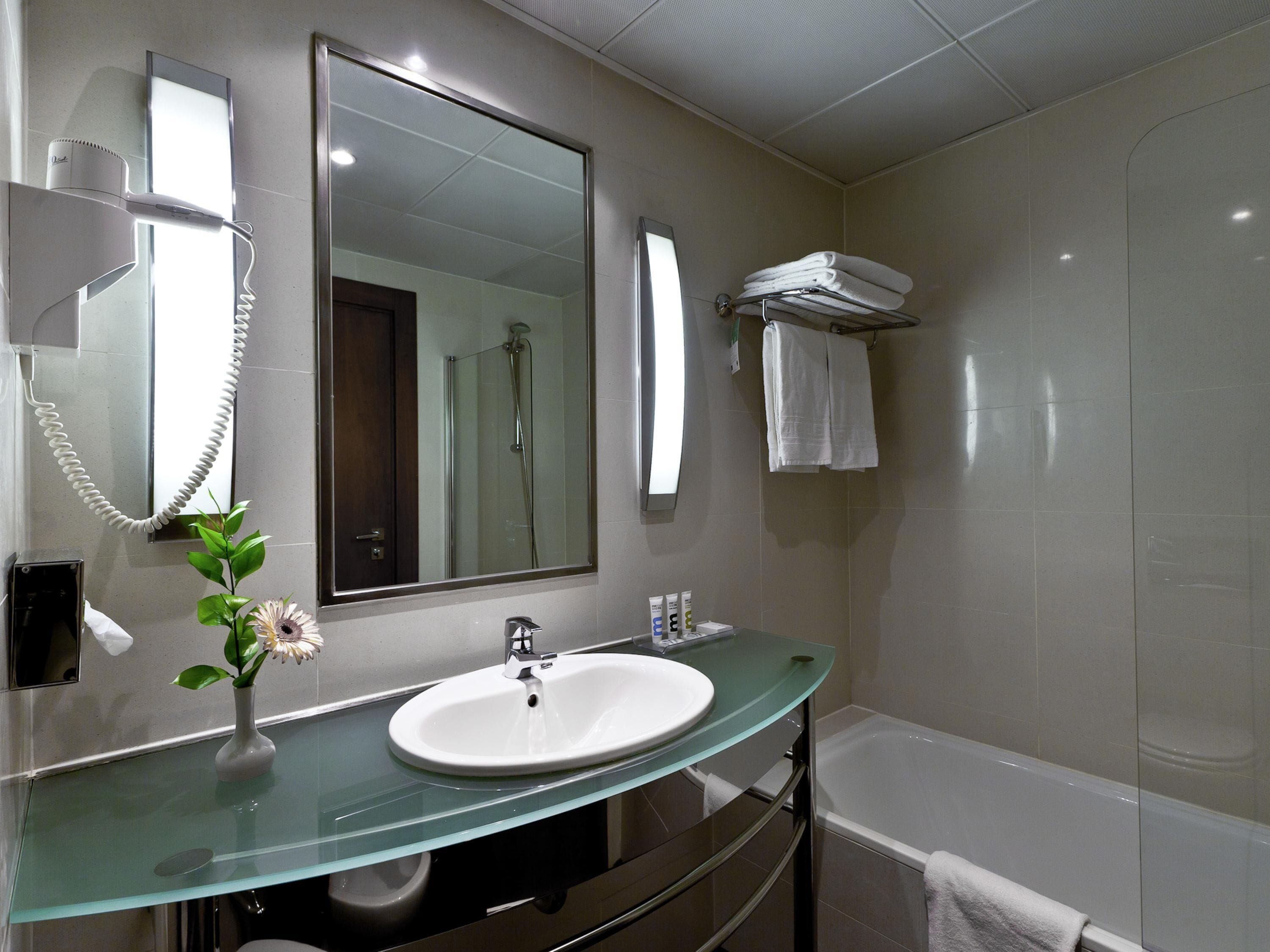 Bathtub, eco-friendly toiletries, hair dryer, bidet