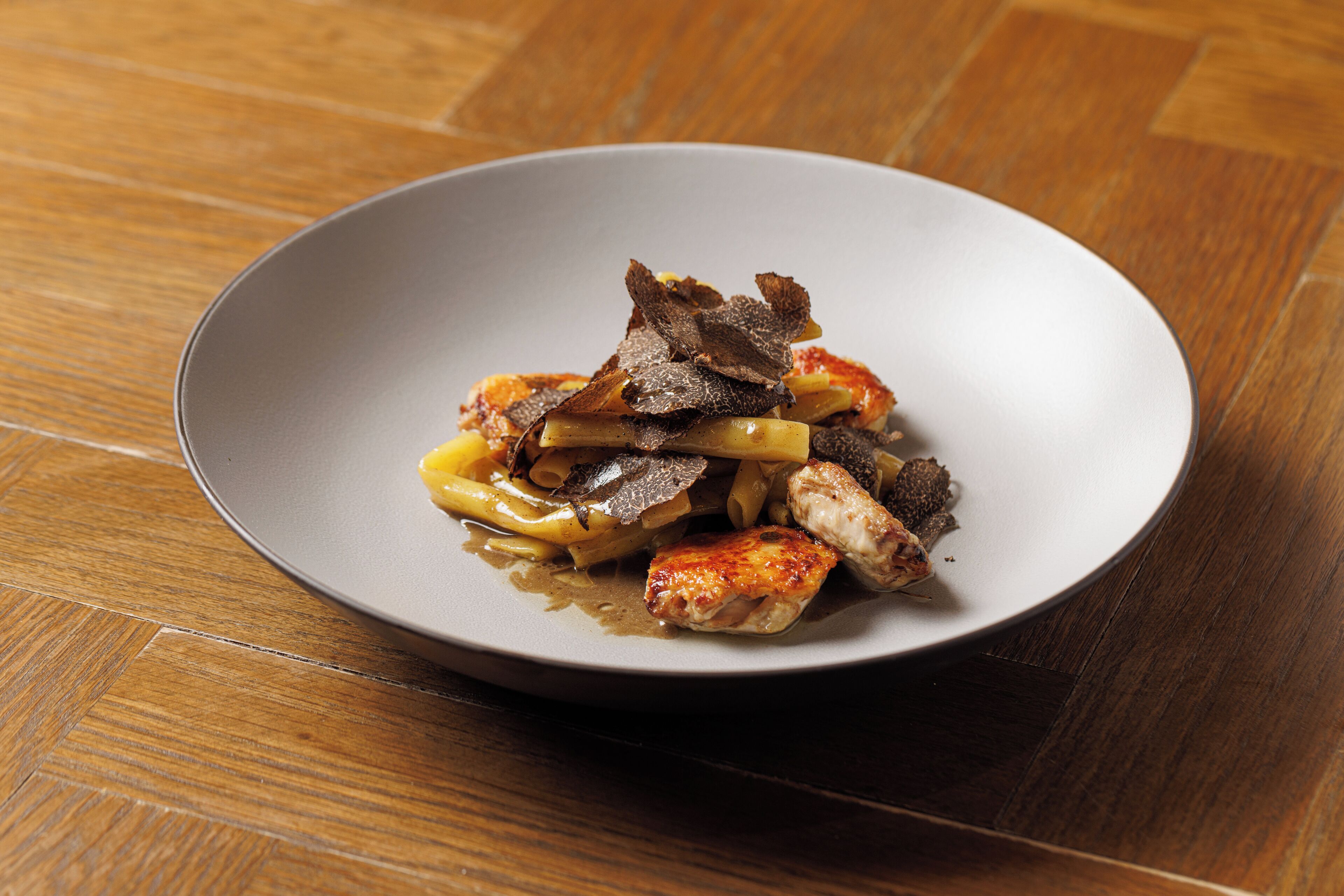 A plate of food on a wooden table.