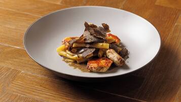 A plate of food on a wooden table.