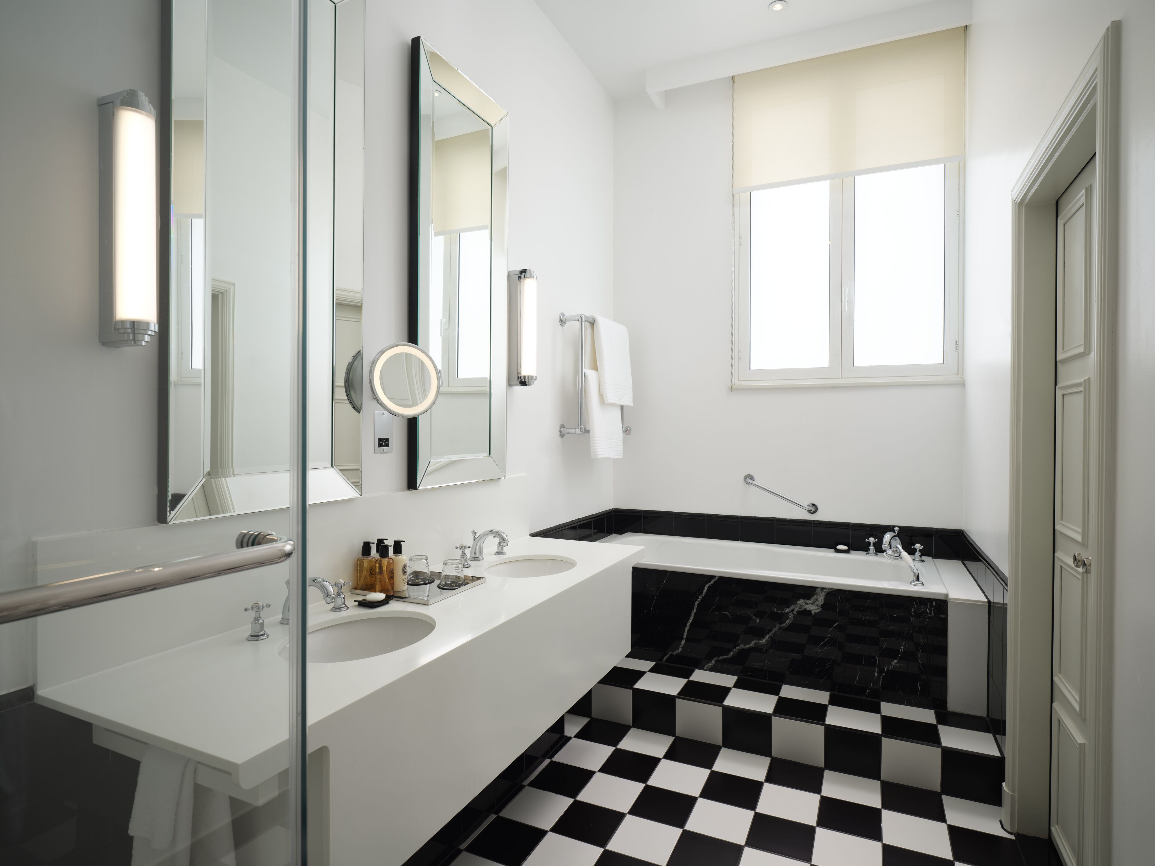 deluxe suite, 1 king bed with sofa bed (separate living room with sofa bed) | bathroom | designer toiletries, hair dryer, bathrobes, slippers