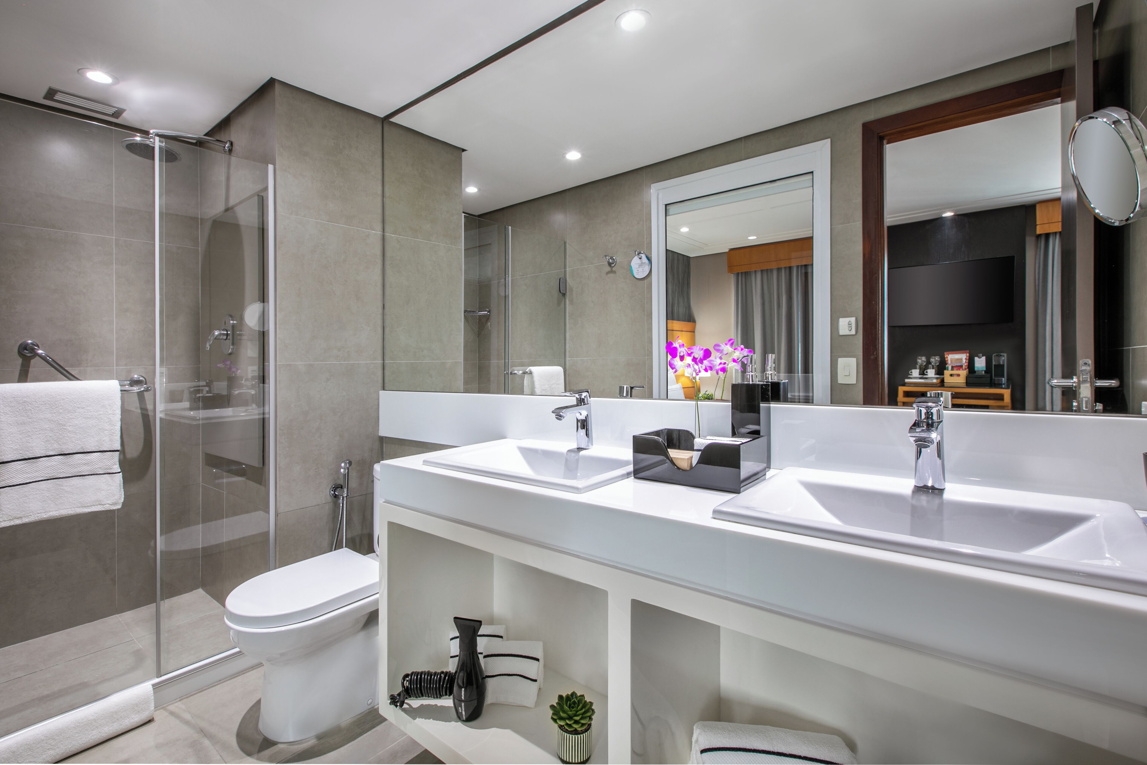 junior suite (executive the level) | bathroom | shower, rainfall showerhead, eco-friendly toiletries, hair dryer
