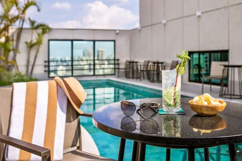 Outdoor pool, open 8:00 AM to 5:00 PM, pool loungers