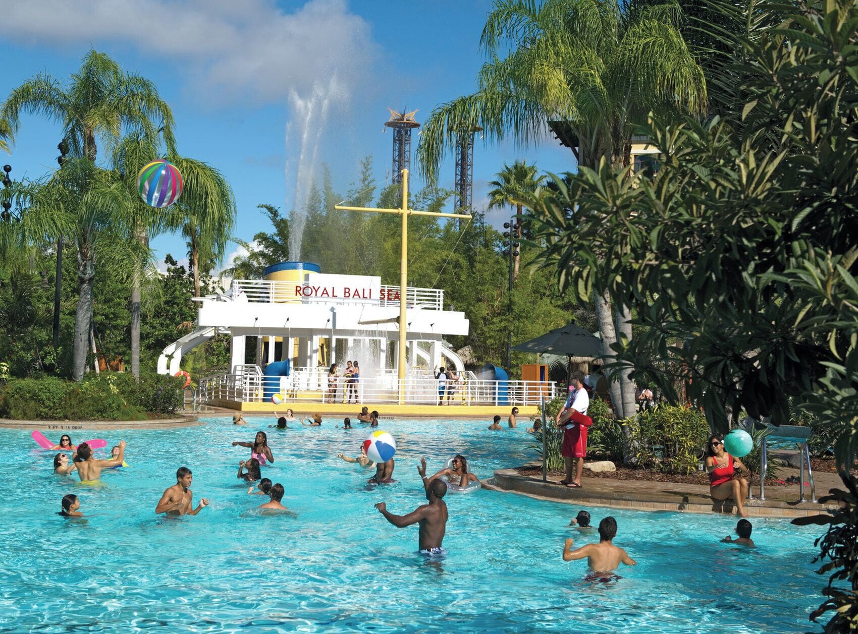 A pool area with a water slide and a building labeled 'ROYAL BALI'.