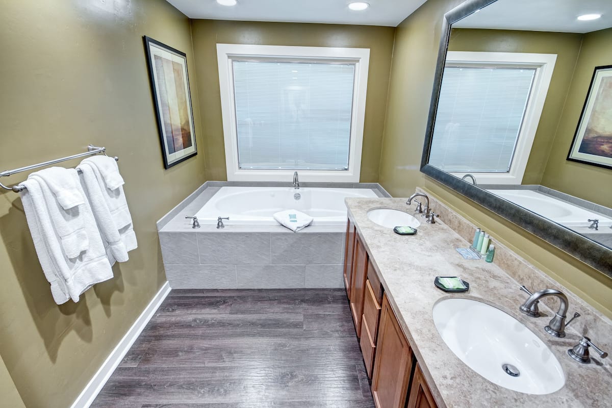 separate bathtub and shower, jetted bath, hair dryer, towels