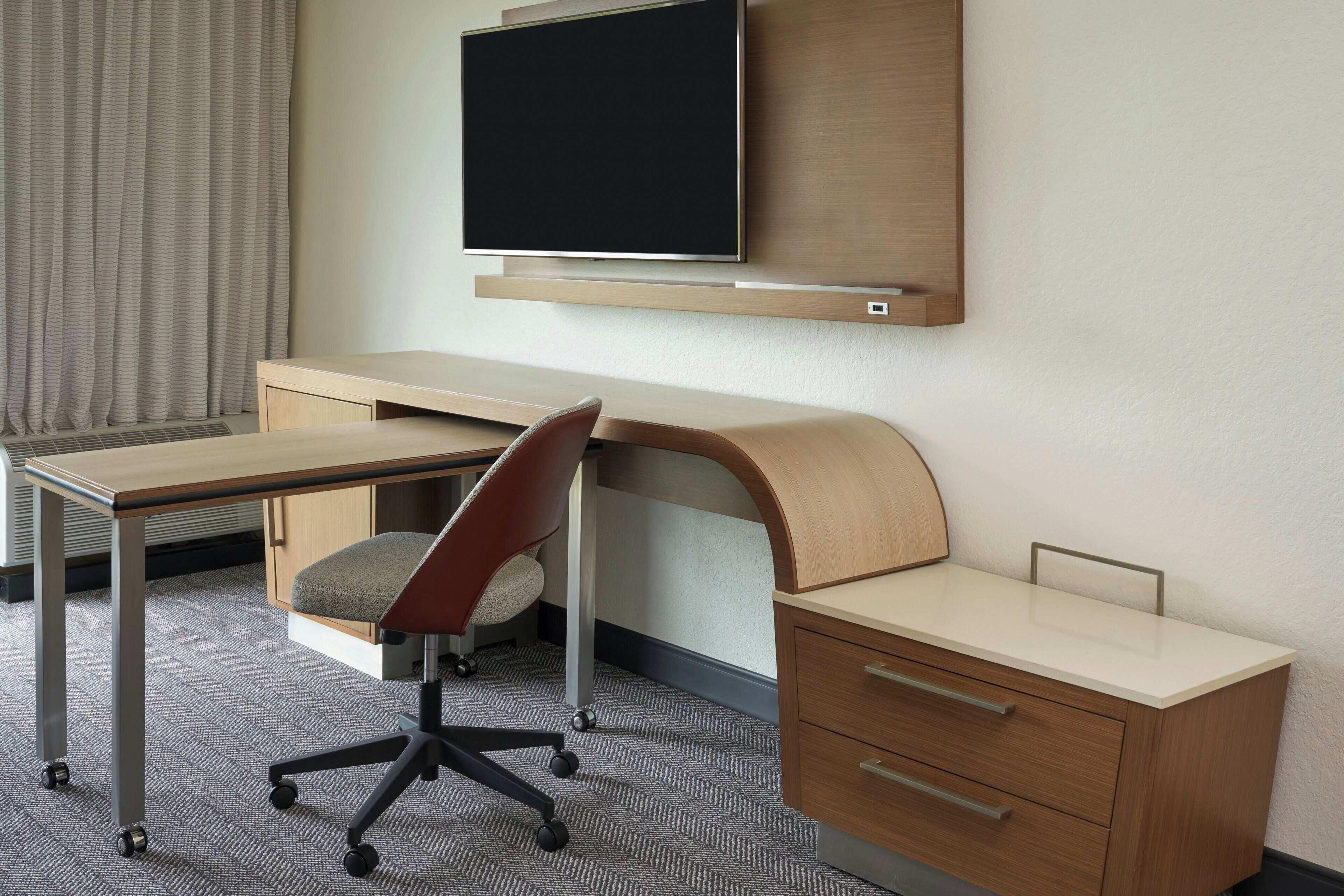 premium bedding, desk, laptop workspace, blackout curtains