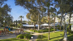 A park with playgrounds, picnic areas, and a covered seating area. - Richmond Ephesus Resort - All Inclusive (Selçuk)
