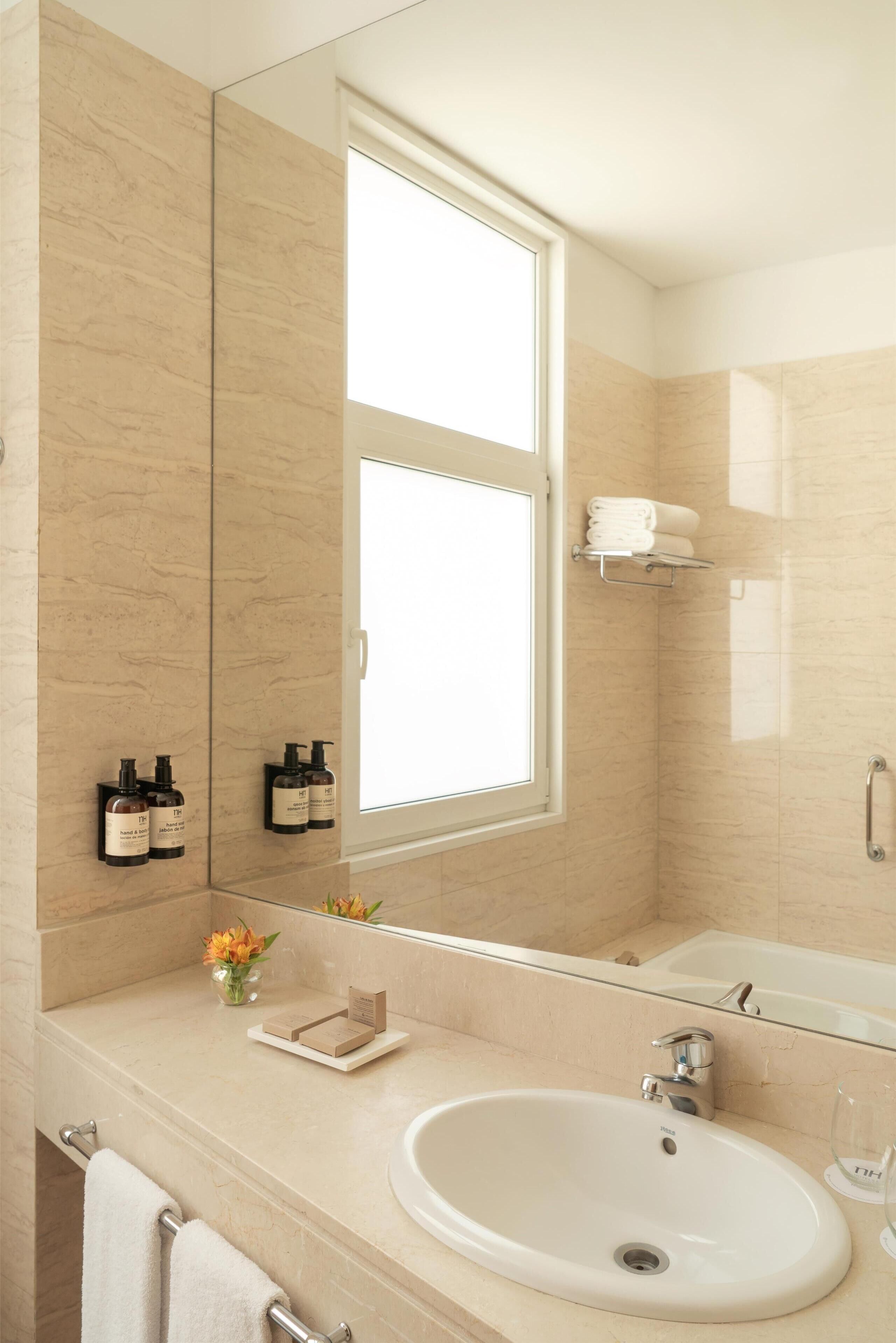 deep-soaking bathtub, rainfall showerhead, eco-friendly toiletries