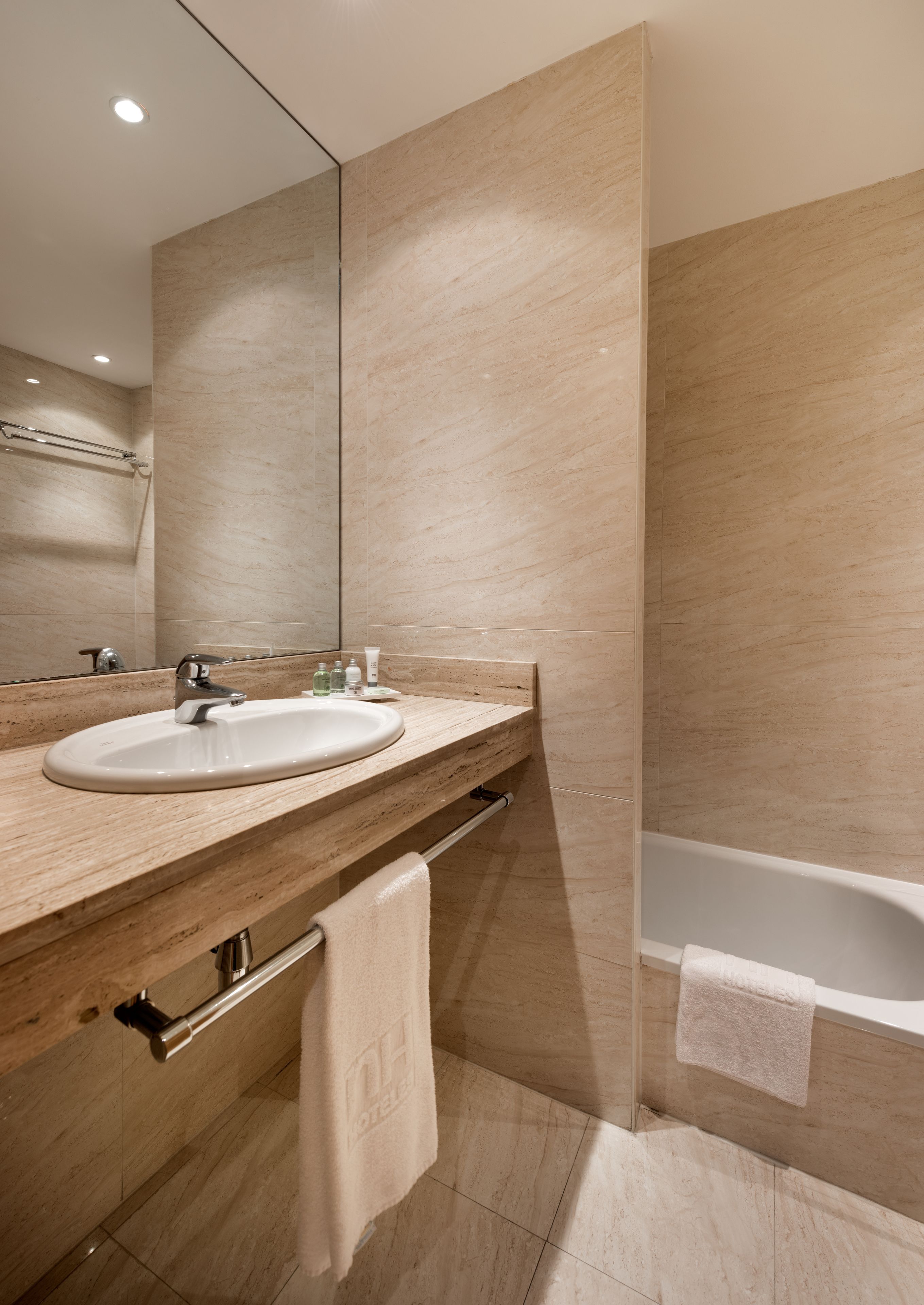 bathtub, free toiletries, hair dryer, towels